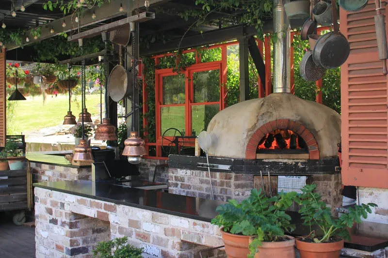 Brick pizza oven in stone hearth