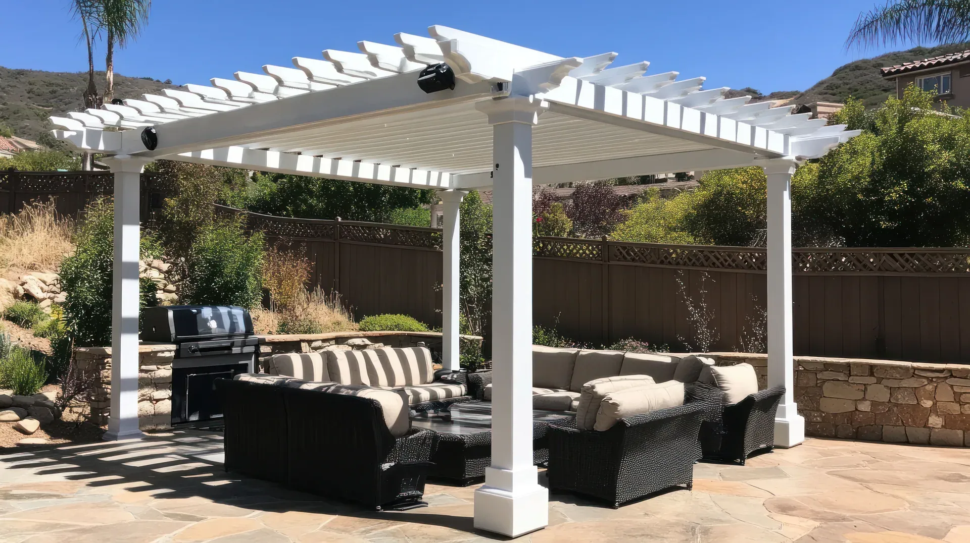 Covered patio at dusk with warm pergola lights